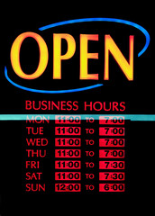 Back lit OPEN business days and hours sign.