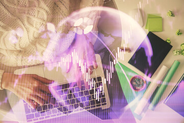 Multi exposure of woman hands working on computer and forex chart hologram drawing. Top View. Financial analysis concept.