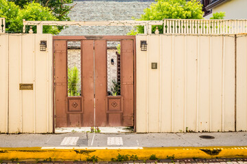 Metal Double Door Leading into a Courtyard