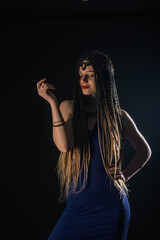 Portrait of a natural native, mystery girl wearing braids that looks like an ancient goddess.