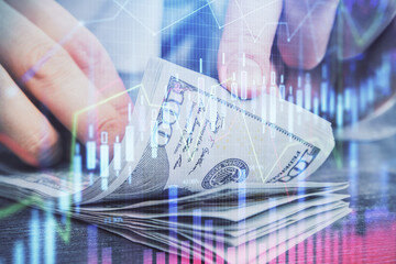 Multi exposure of forex graph drawing hologram and USA dollars bills and man hands. Technical Analysis concept.