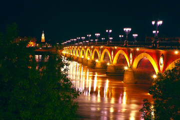 Fototapeta na wymiar Bordeaux Pont de Pierre in the night . Garonne river and illuminated bridge de Pierre in Bordeaux
