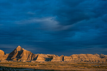 Dramatic Clouds Over Badlands Formation