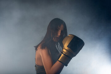 Portrait of fit girl, wearing boxing gloves