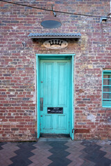 Green Door On Brick Wall