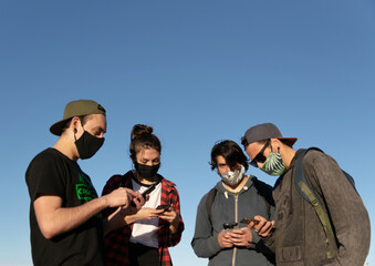 Group of people looking at their smart phones, social media concept, copy space, millennial, social networks, working group