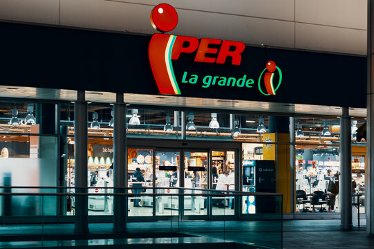 Iper logo and showcase of the store at night. Iper is the brand with which Finiper Spa, operates, a large-scale distribution company. Milan, Italy - 29.12.2019