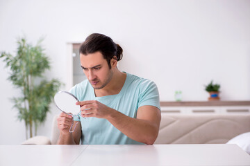 Young man suffering from toothache