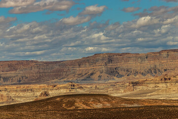Fototapeta na wymiar Barren landscape beautified by teal skies and clouds near Page, AZ