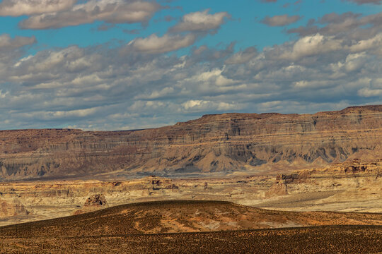 Barren landscape beautified by teal skies and clouds near Page, AZ