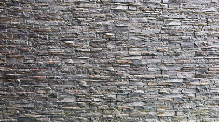 Granite wall. Modern style stone wall background and texture, decorative stone lined design. Selective focus