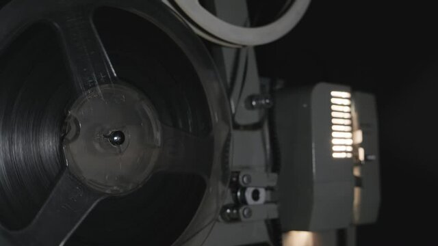 Old 8 mm projector showing film, 4k