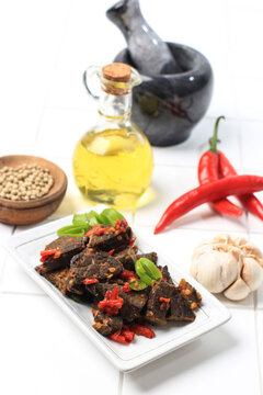 Balado Paru, Traditional Indonesian Food Made from Beef Lungs. Cooked with a Lot of Chilli, Garlic, Shallots, and Lime Leaf. Delicious with Spicy Taste.