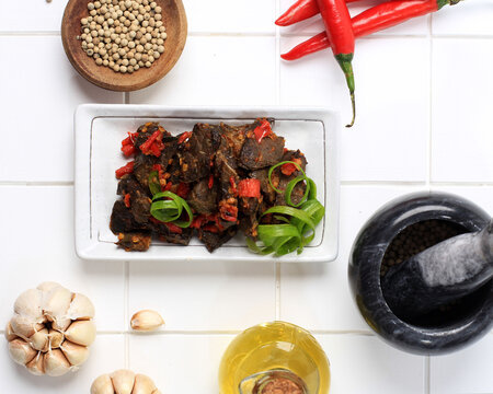 Balado Paru, Traditional Indonesian Food Made from Beef Lungs. Cooked with a Lot of Chilli, Garlic, Shallots, and Lime Leaf. Delicious with Spicy Taste.