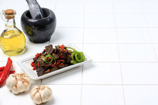 Balado Paru, Traditional Indonesian Food Made from Beef Lungs. Cooked with a Lot of Chilli, Garlic, Shallots, and Lime Leaf. Delicious with Spicy Taste.