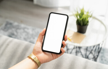 Woman hand holding smartphone and the screen is blank, social network concept, copy space for your advertising.