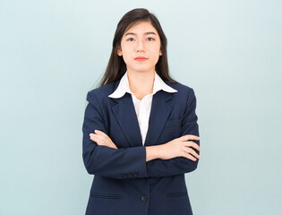 Teenage girl long hair is standing with her arms crossed