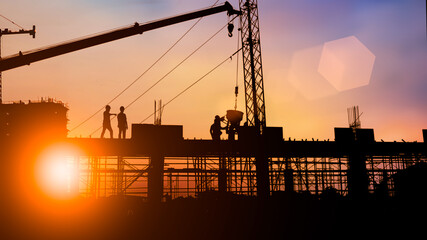 Silhouette of Survey Engineer and construction team working at site over blurred  industry background with Light fair Film Grain effect.Create from multiple reference images together