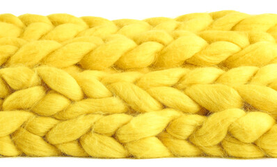 Yellow knitted plaid on white background, closeup