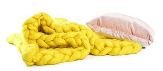 Yellow knitted plaid with pillow on white background