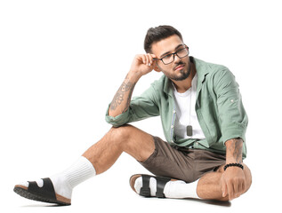 Fashionable young man on white background
