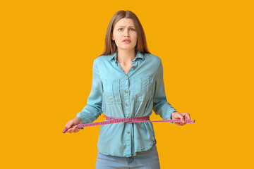 Woman with sudden weight loss problem on color background. Diabetes symptoms