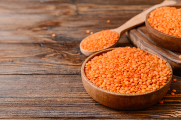 Composition with raw lentils on wooden table