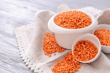 Composition with raw lentils on wooden table
