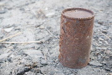 close up old rusty can on the ground