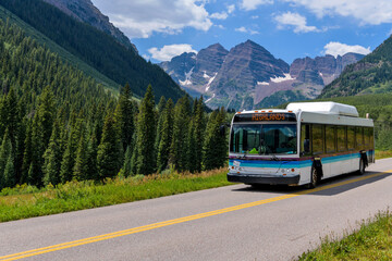Shuttle at Maroon Bells - During daytime hours of Summer and Autumn, Shuttle buses, running between Highlands and Marron Lake, are only vehicles allowed into Maroon Bells Scenic Area.  Aspen, CO, USA.