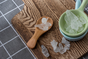 Rock Sugar on wooden spoon and ceramic bowl
