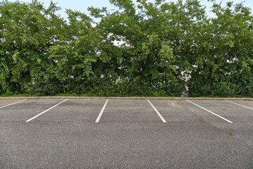 Empty places in a parking lot - Powered by Adobe