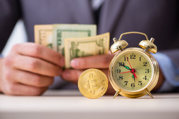 Young man earning money via Internet in time management concept