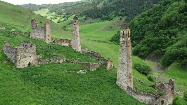 Aerial view of medieval tower complex in the mountains of Ingushetia, Russia, 4k