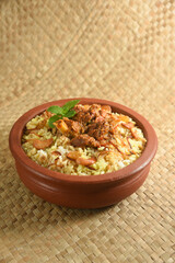 Mutton biryani , Gosht or lamb biryani or Hyderabadi Dum biriyani with raita yoghurt dip special occasion festival food  for Ramadan , Eid Hyderabad India.