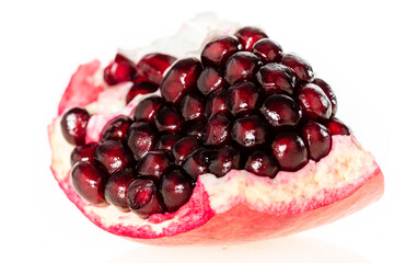 Close-up of pomegranate fruit with infinity white background