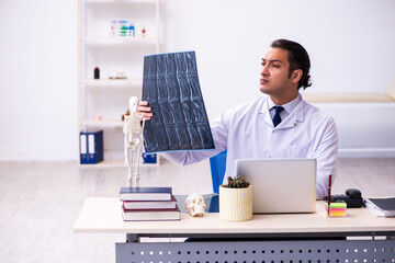 Young male doctor radiologist working in the clinic