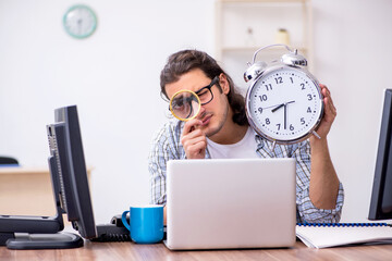 Young male it specialist working in the office