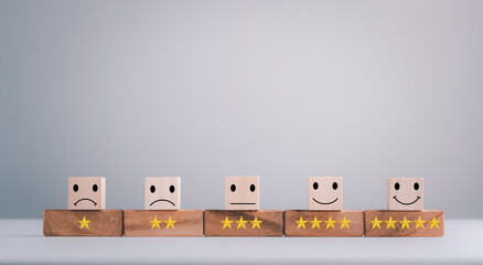 feedback rating and positive customer review experience, service and Satisfaction, wood block with 1 to 5 star icon to give satisfaction in service. rating very impressed. Mental Health Assessment.