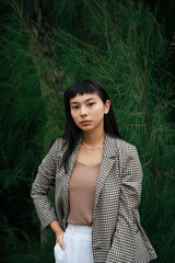 Portrait of asian business woman in formal shirt in nature background.