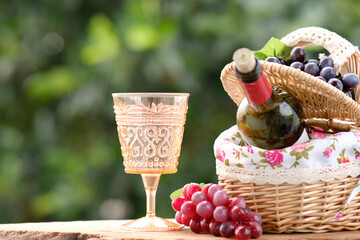 picnic basket with grapes and wine