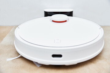 Robot vacuum cleaner return to charge after cleaning room Modern smart household