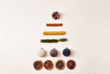 Christmas composition. Christmas tree made of dried fruits, festive balls, cones and fir branches