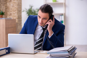 Sick male employee suffering at workplace