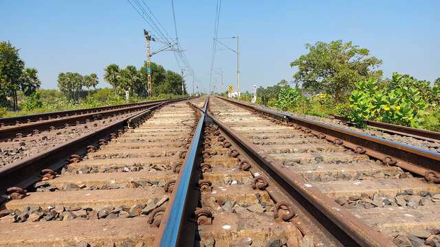 railway tracks in the village side with blue sky