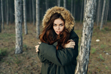 woman in hooded jacket nature forest lifestyle