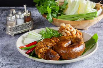 Sai Aua (Notrhern Thai Spicy Sausage) on a wooden background