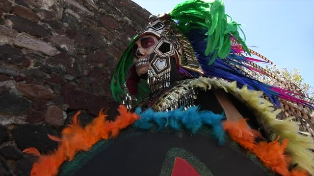 Aztec warrior close-up with colored feathers