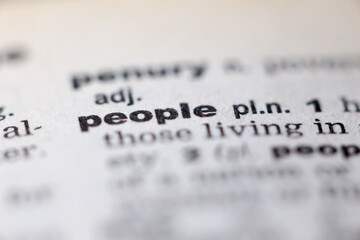 Macro close up of old English dictionary page with word people