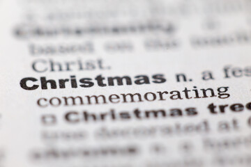 Fototapeta premium Macro close up of old English dictionary page with word Christmas